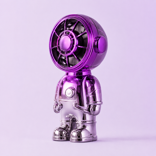 Astronaut-shaped mini desktop fan with purple helmet fan head, silver body, protective front grille and chest button control.