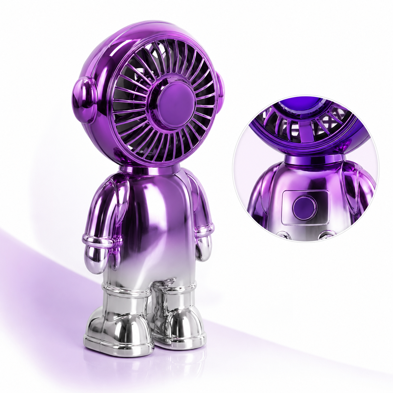 Astronaut-shaped mini desktop fan with purple helmet fan head, silver body, protective front grille and chest button control.